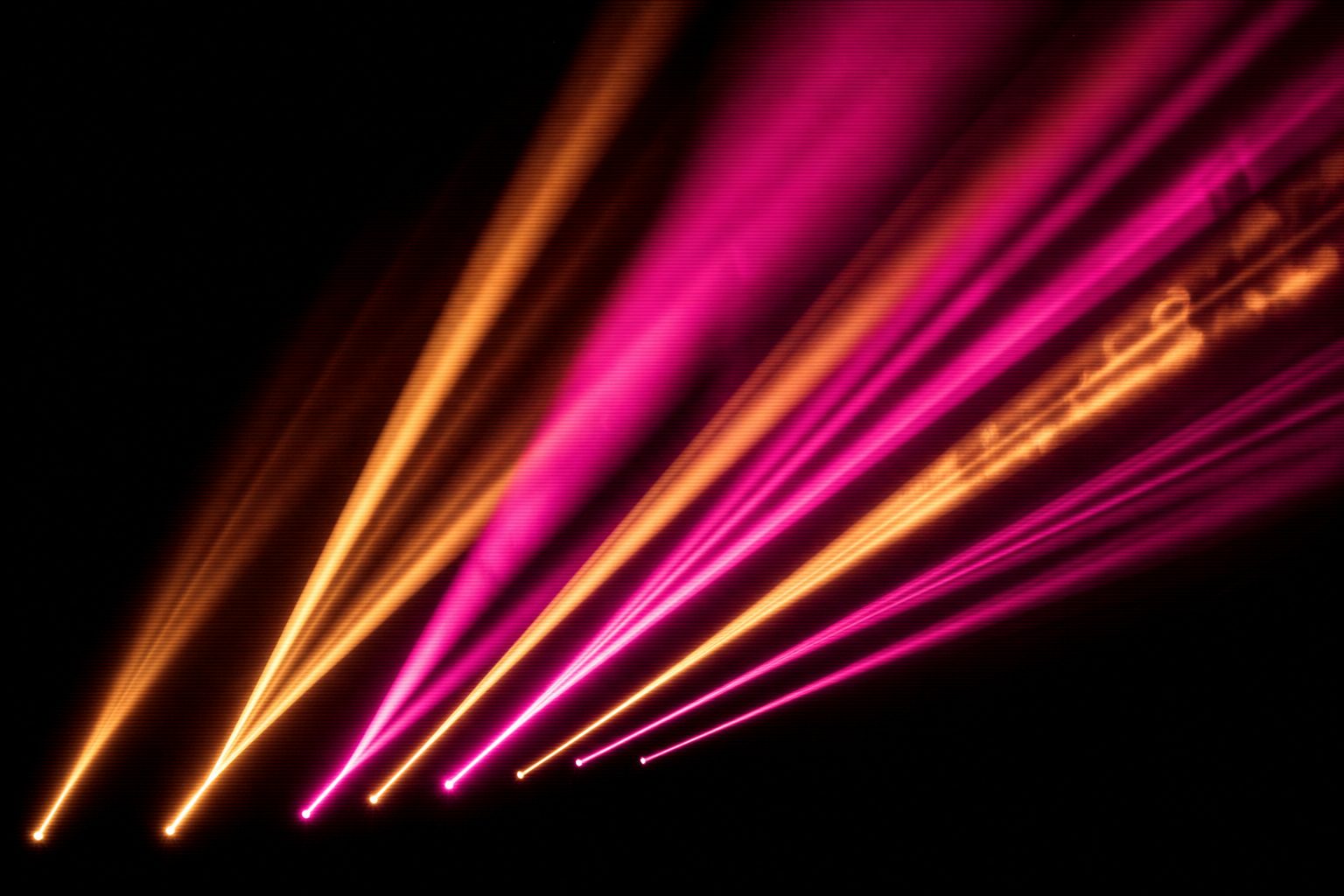 A single coherent field of magenta and amber light where every element points the same way, deliberate and composed.