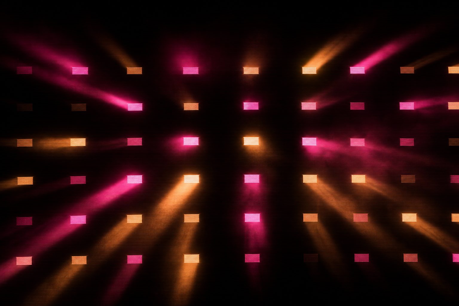 Clip banks shown as a grid of glowing rectangles, each pulsing at a different intensity.