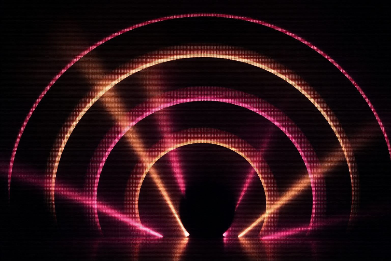 A series of concentric arcs receding into darkness, each arc catching a hard raking light along its leading edge, the geometry reading as a shell that frames whatever stands in front of it.